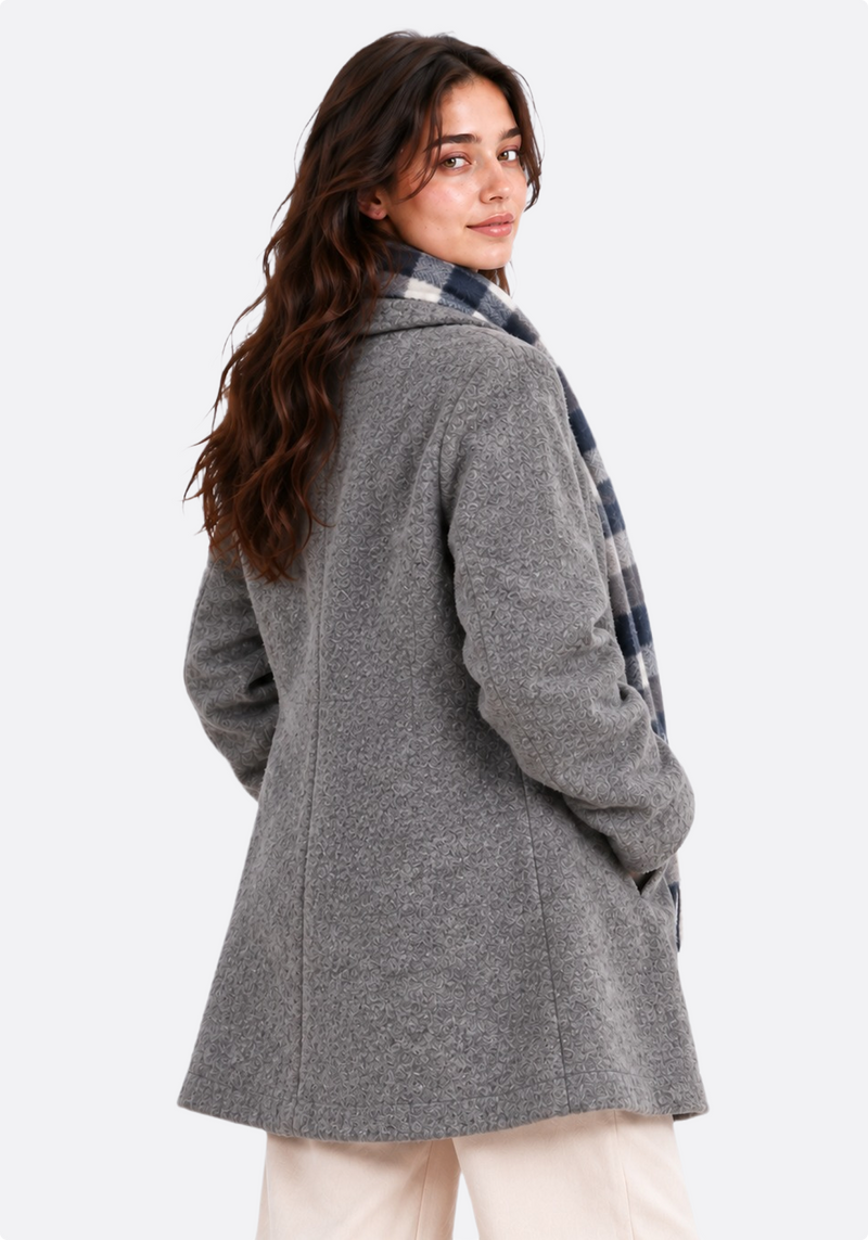 Women's grey bouclé wool coat – front three-quarter view with scarf